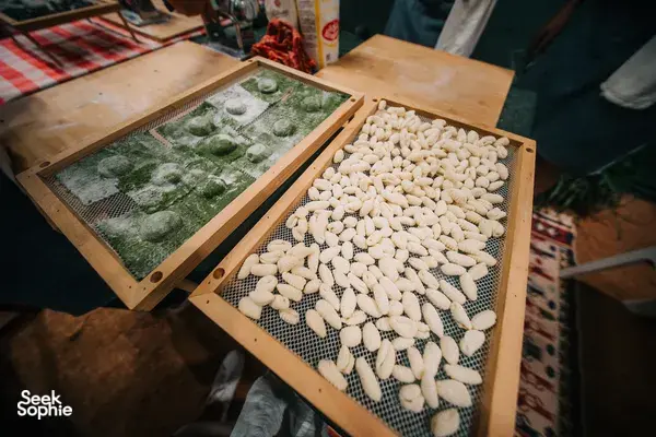 Rows of shaped gnocchi on wooden drying trays on a kitchen table in Singapore during a pasta-making class — workshops in Singapore