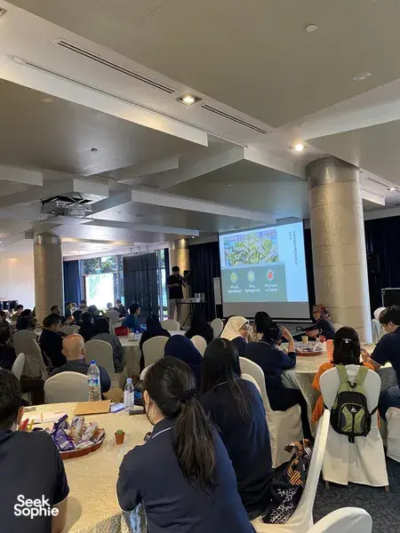 Workshop audience seated in a lecture room as Urban Green Dot presents sustainable microgreens for workshops in Singapore