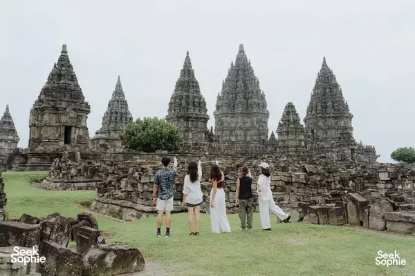 Visitors stroll across the Prambanan temple lawn during a 10-hour private car and driver hire with Picnic Indonesia in Yogyakarta