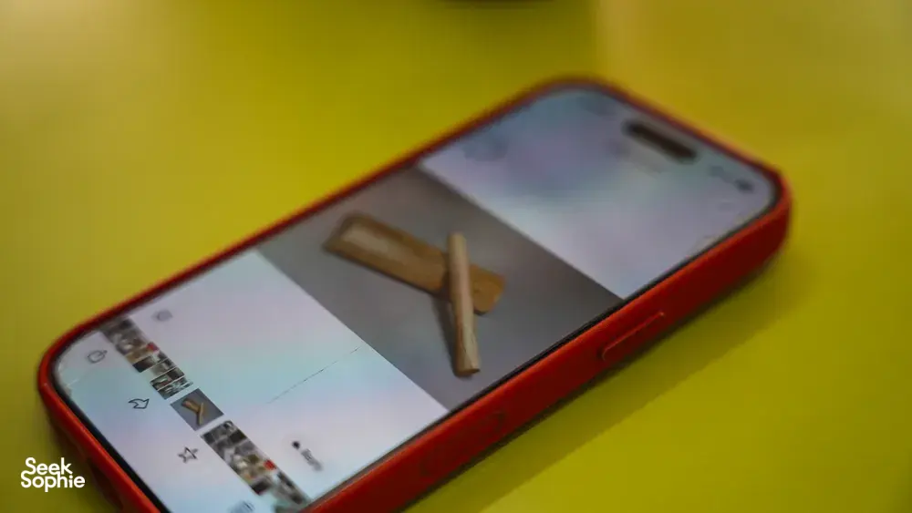 Smartphone with red case on a yellow table showing a hawker snap during Jenny Dorsey’s Hidden Hawker Stories in Singapore — Singapore hidden gems