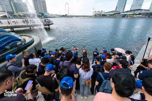 People gathered on a Singapore bayfront for the Survive The Collapse sustainability scavenger hunt, ideal for team building Singapore
