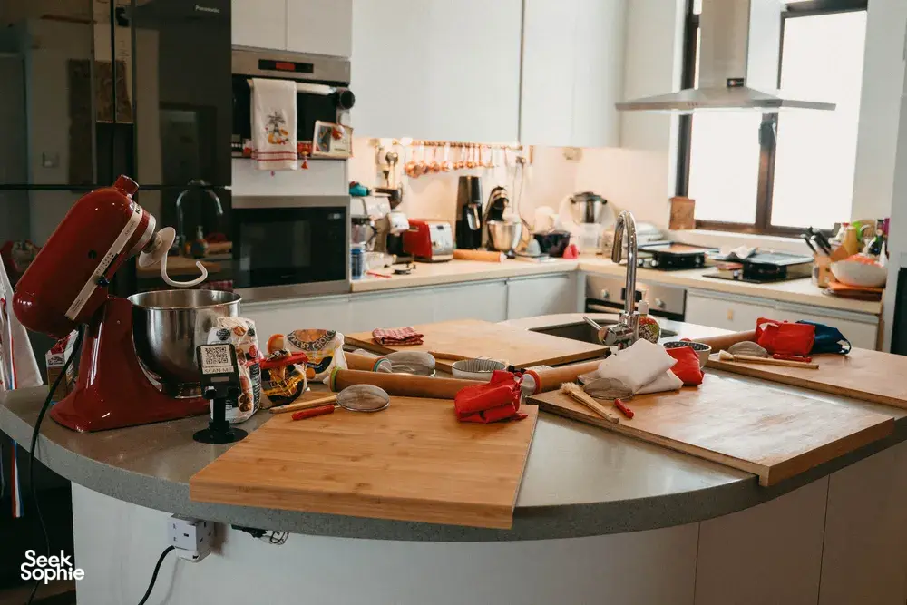 Baking station in a Singapore kitchen with trays, tools and an oven, ready for croissant-making at French Cooking Lab today