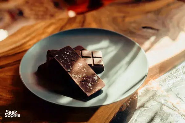 Salt-crusted chocolate squares arranged on a plate during a bean-to-bar session with The Unexpected in Singapore, workshops in Singapore