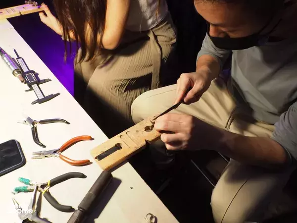 Participant carving a wax jewellery design at The Imperial Smithster’s basic silversmithing workshop in Singapore — workshops in Singapore