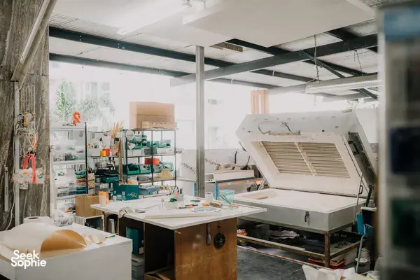 Glass studio in Singapore with a kiln and workbench for creating centrepieces, tools arranged—workshops in Singapore
