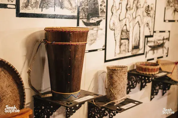 Woven baskets and wooden drums displayed in a corner at Sepilok Tropical Wildlife Adventure, base for Kinabatangan River safari