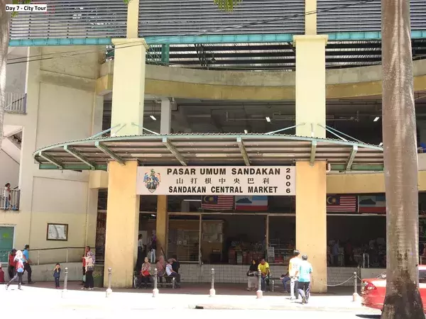 Sandakan Central Market entrance sign above a walkway, featured on the city tour for the Kinabatangan River