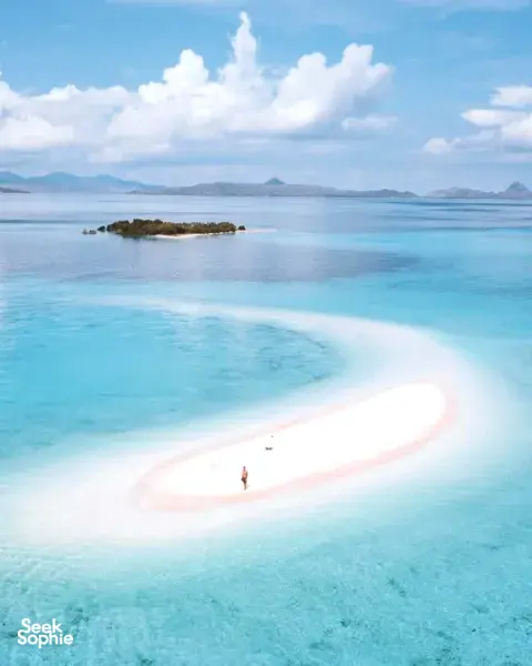 Aerial view of a white sandbar in turquoise water, seen during the Fanie Boat Tours 3D2N Komodo dive liveaboard Komodo Island