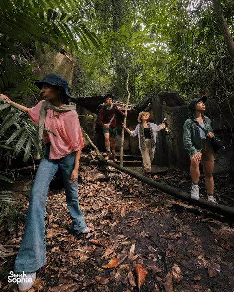 Hikers on a shaded path in Fort Serapong, Singapore, during a private time-travel discovery trail — Singapore hidden gems