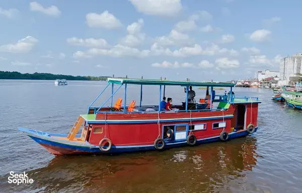 Sister Tour red small boat ready for a 3D2N couple cruise on the waterways in Tanjung Puting National Park, Pangkalan Bun