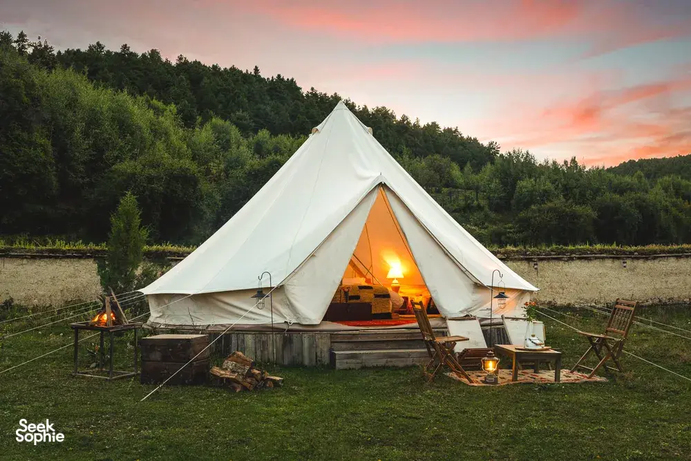 White canvas tent lit by lanterns during a 2D2N Tibetan mountain valley stay with Caravan Treks by Ferme Liotard in Shangri-La
