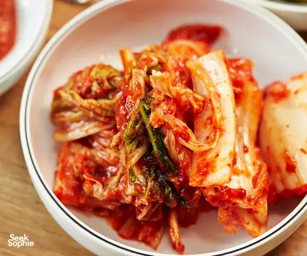 Close-up of freshly made Korean kimchi in a bowl from a Korean chef’s dine-in kimchi-making experience in Singapore