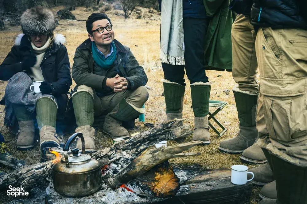 Around a campfire at a Ferme Liotard-hosted nomadic caravan campsite in Shangri-La’s high valleys, pots and cups cooking