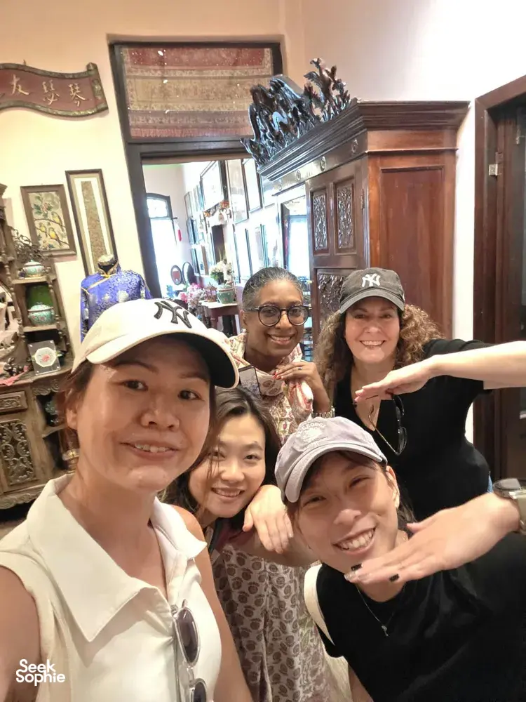Friends selfie inside a heritage lane in Katong-Joo Chiat, Singapore, during a real-life Monopoly team building game  Singapore hidden gems