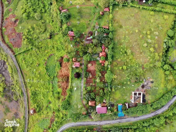 Aerial view of Saifana Organic Farm’s permaculture plots, ponds and pathways surrounded by greenery in Lombok