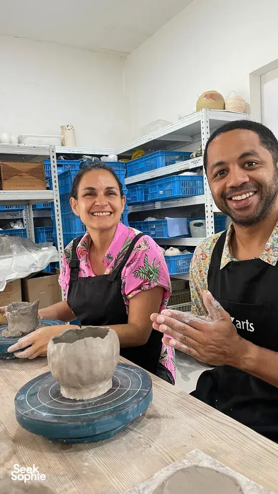Join hands-on workshops in Singapore at 3Arts Pottery, where a host guides hand-building clay on a wheel
