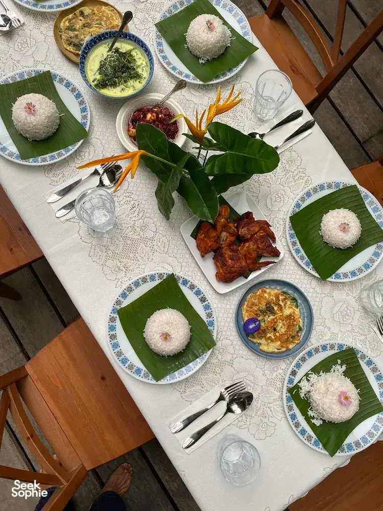 Table set with rice, curries and fried sides at Kebun Lidstari in Langkawi, where Malaysian comfort food is served