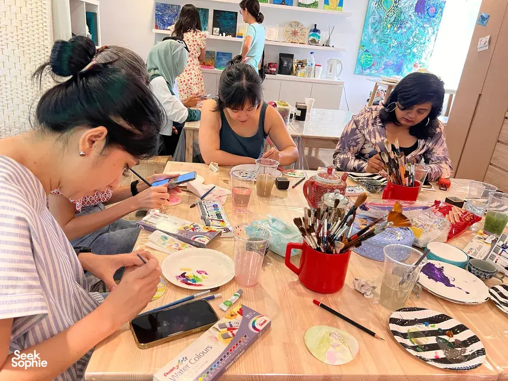 People painting in an Art For Good art therapy for all ages workshop in Singapore — workshops in Singapore