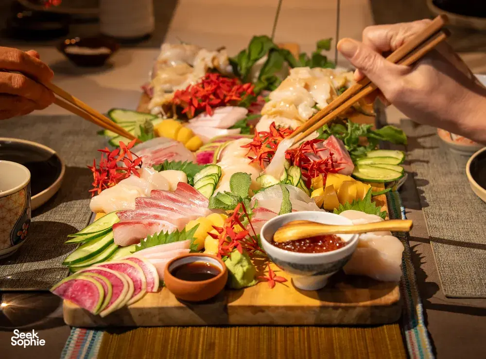 Assorted Japan-inspired grazing platter on a table with seafood, vegetables and dipping sauces at Primateve, private dining Singapore