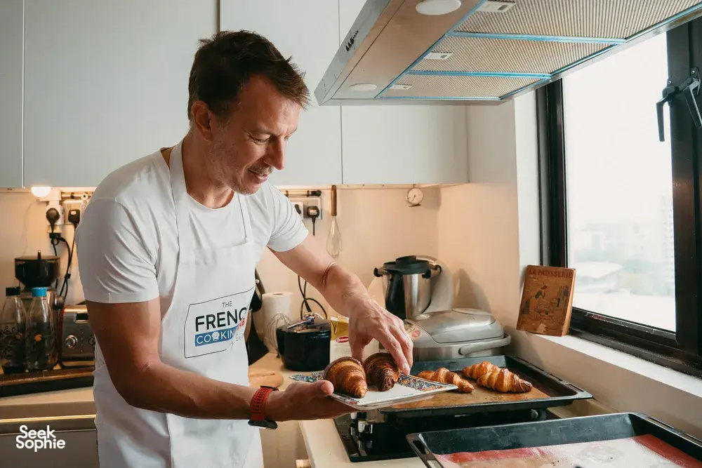 Eric shapes croissant dough in Singapore at French Cooking Lab during a French-chef baking class session