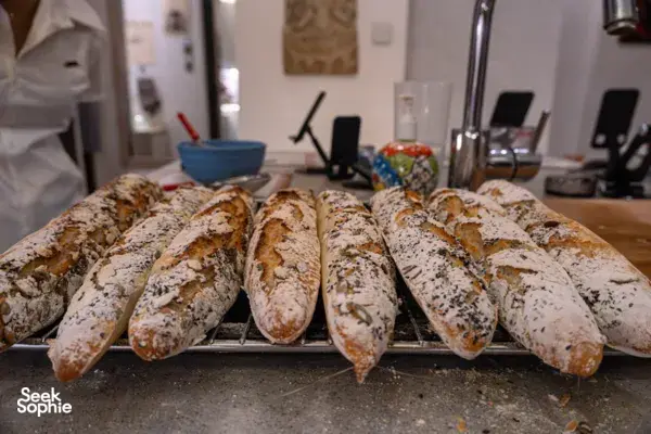 Baked French baguettes on a tray in a Singapore kitchen as part of French cooking workshops in Singapore