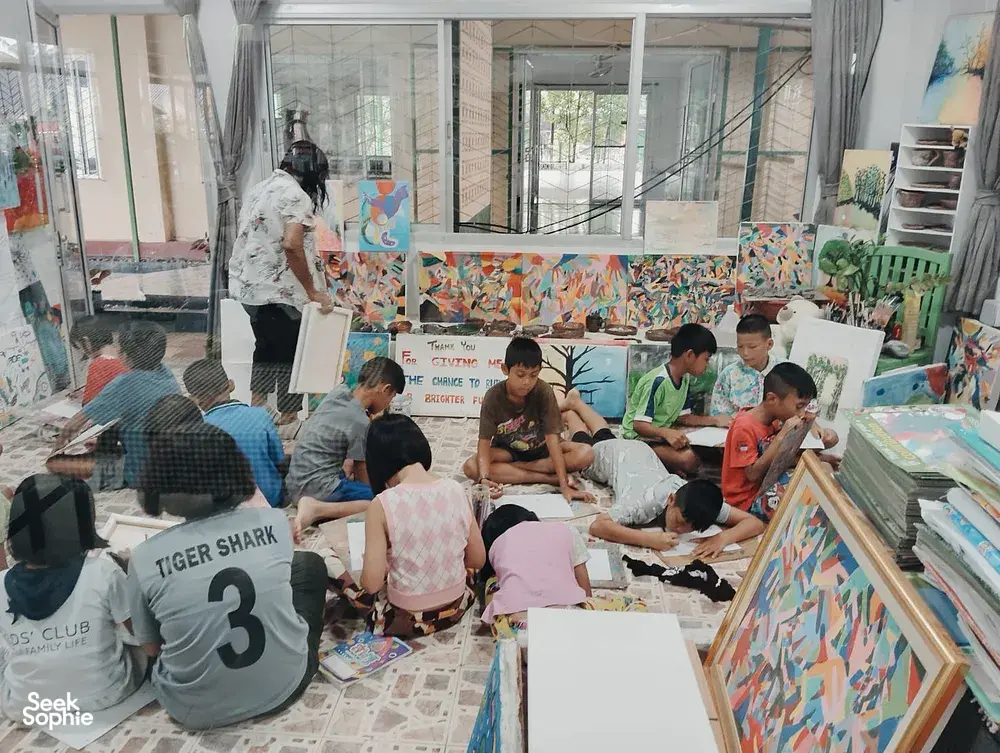 Children’s art and learning session at a community centre in Khao Lak, led by Hands Experiences Thailand for education impact