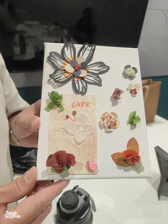 Handmade vision board with layered paper flowers during Gemstory vision boarding for birthday activities Singapore
