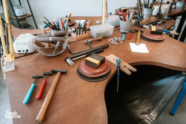 Metalsmithing studio workbench at Fat Anvil Studios in Singapore with tools, leather mat and ring-making supplies — workshops in Singapore