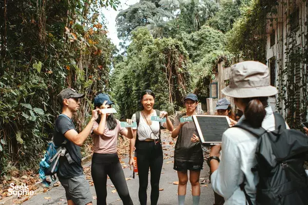 Walking tour along Fort Serapong’s greenery with small group listening to instructions nearby, Singapore hidden gems