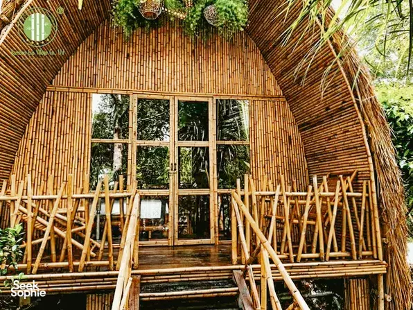 Luxury eco-homestay building at Bamboo Eco Village in Cần Thơ’s Mekong Delta, an arched bamboo room with large window doors