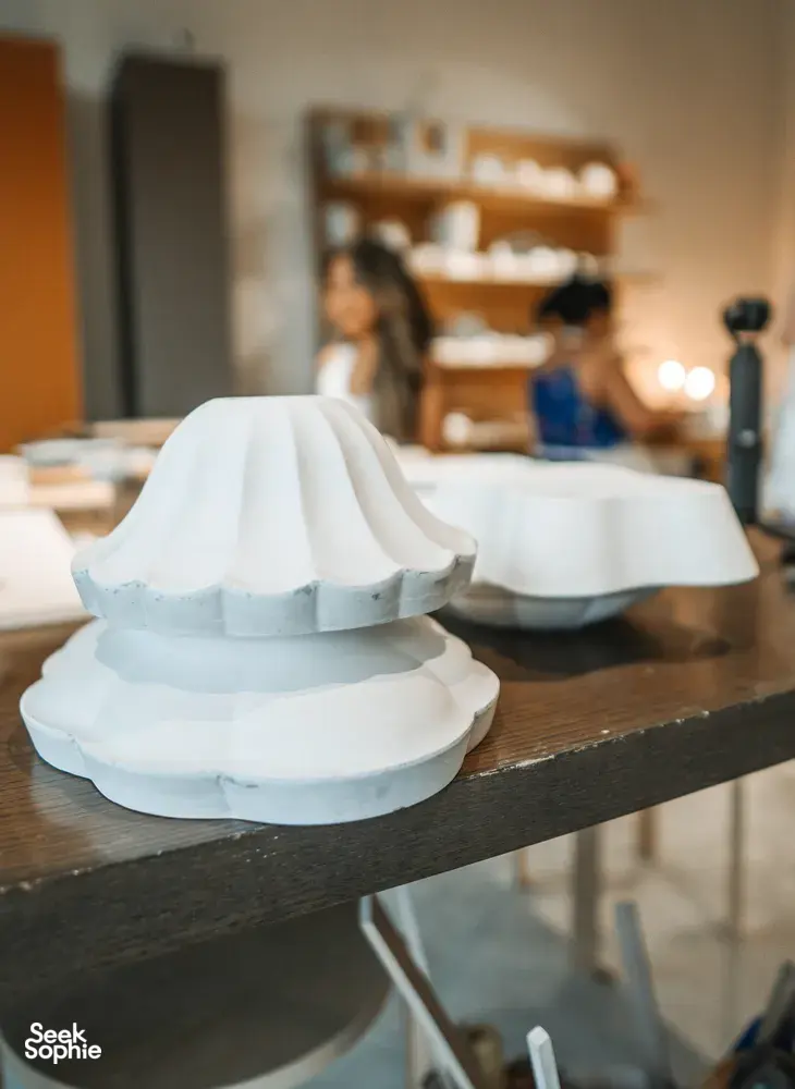 Ina Atelier studio table with handmade antique-style European ceramics plates and bowls, crafted for everyday dining workshops in Singapore