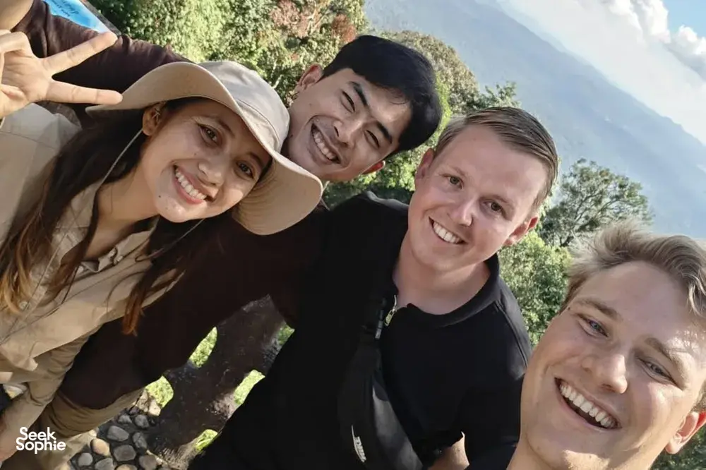Small group of travellers smiling on a scenic stop during a day trek with Wildlife Safari Thailand in Khao Yai National Park
