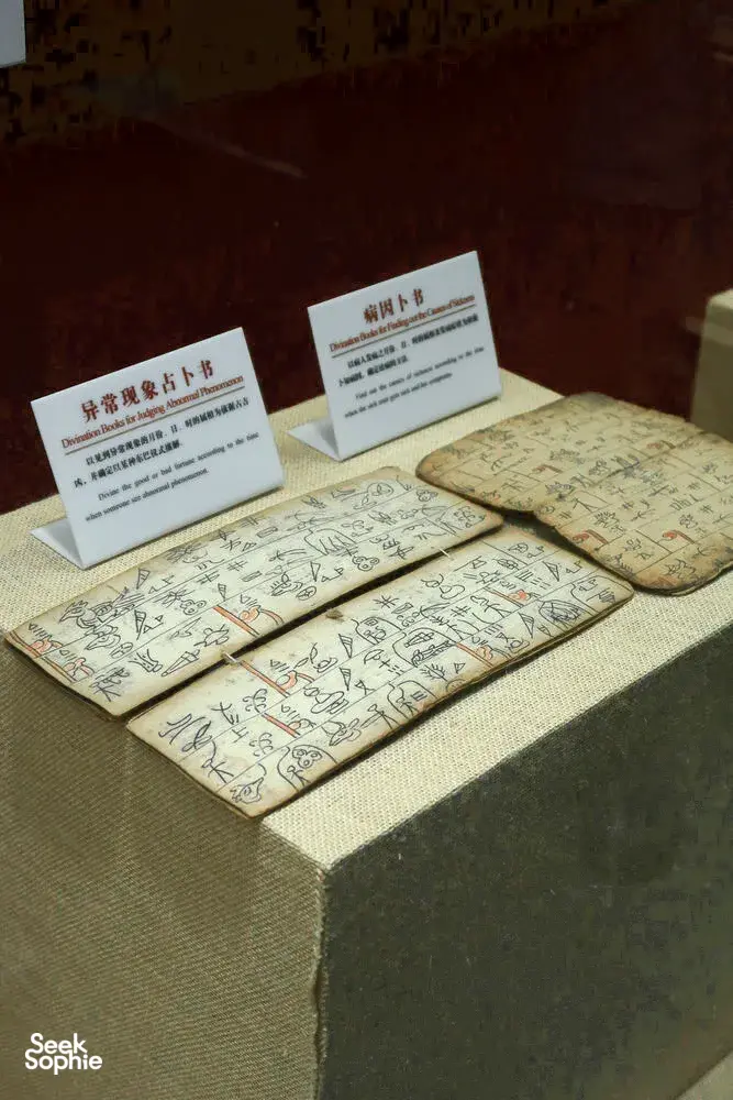 Welcome table with illustrated guides, folded maps, and name cards arranged at The Bivou Lijiang in Lijiang