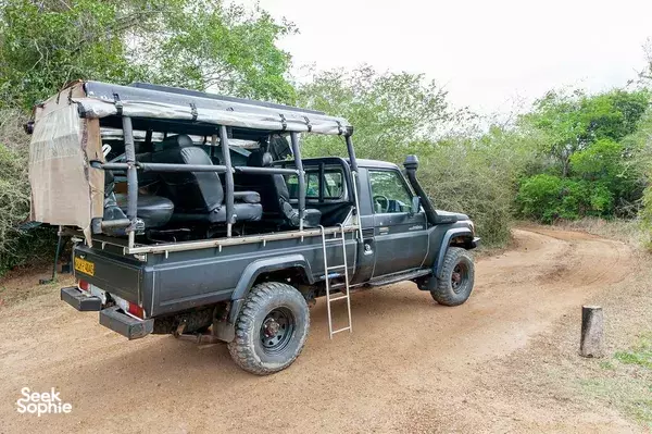 Safari jeeps like this at Leopard Trails travel along a dusty track through Wilpattu National Park near Anuradhapura