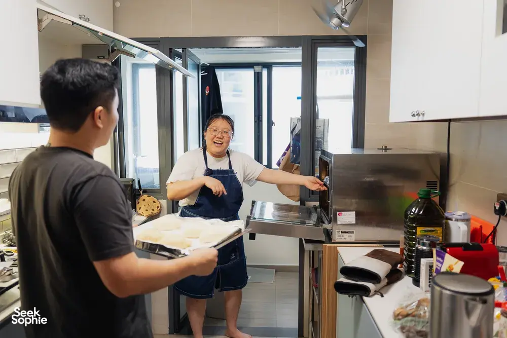 Instructor at a stainless baking station demonstrating shio pan dough while participants watch during hands-on bread workshops in Singapore