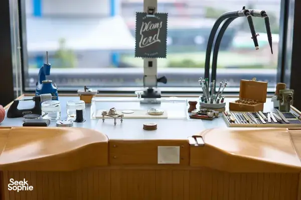Bright Singapore watchmaking classroom bench with tools, parts and loupes for building your own movement—watchmaking workshops in Singapore