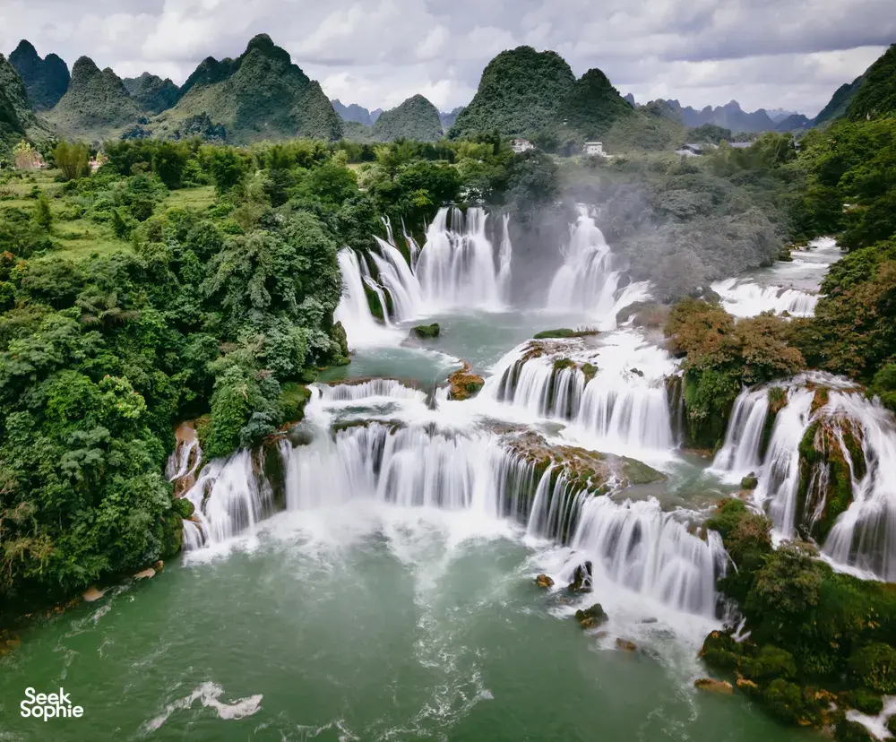 Verdant waterfalls on the 3-day Cao Bang motorbike loop near the China–Vietnam border, hosted by Ha Giang Expeditions