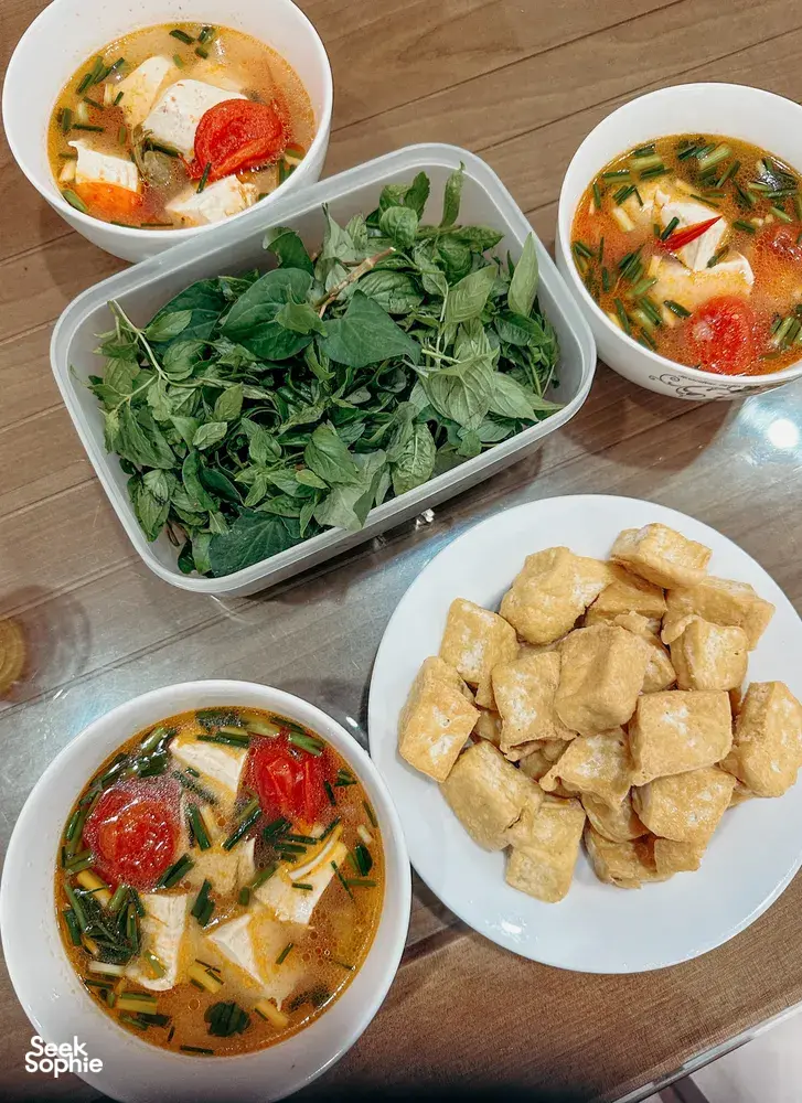 Bowls of Hanoi’s tofu soup with tomato and greens plus a plate of fried tofu at Bamboo Life’s make-tofu workshop