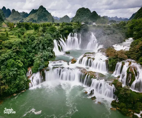 Verdant waterfalls on the 3-day Cao Bang motorbike loop near the China–Vietnam border, hosted by Ha Giang Expeditions