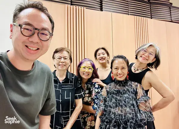 Chong Zheng Calligraphy host with smiling group during Chinese calligraphy introduction in Singapore—ideal for workshops in Singapore