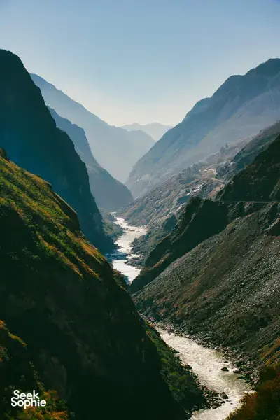 Scenic Tiger Leaping Gorge valley with a winding river, viewed from steep mountain trails near Shangri-La