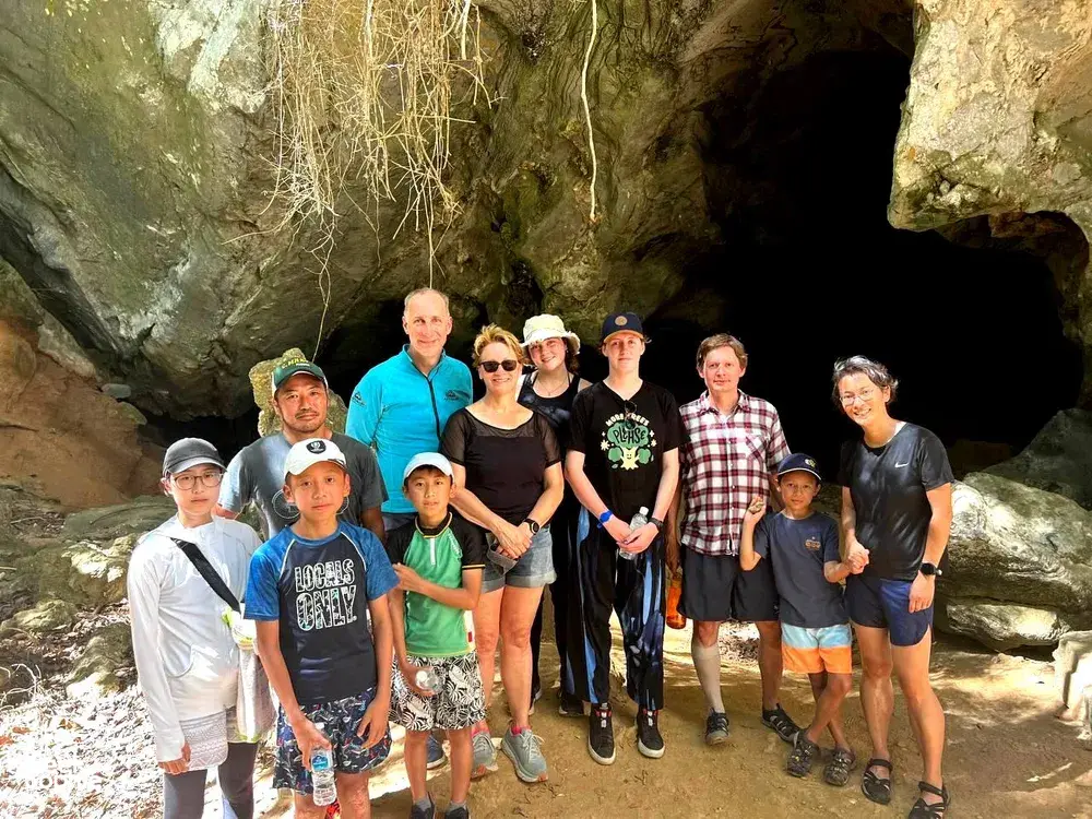Travellers posing inside a limestone cave during a JungleWalla Langkawi guided cave trip in Langkawi, Malaysia