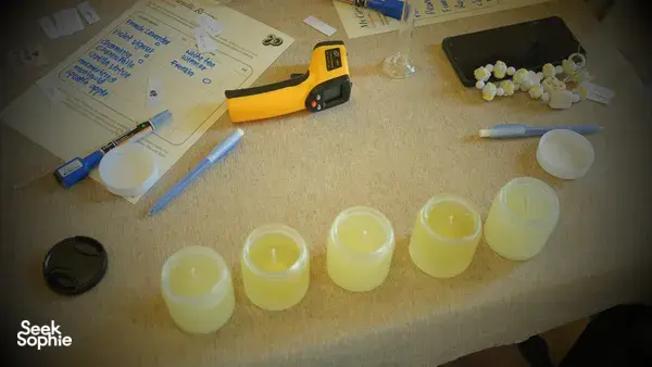 Coco-soy wax cups and fragrance tools laid out for blending with Perfume Play, a candle workshop in Singapore