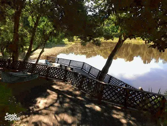 Raised wooden walkway along rainforest water for KOPEL Kinabatangan’s Jungle Lodge safari, on the Kinabatangan River