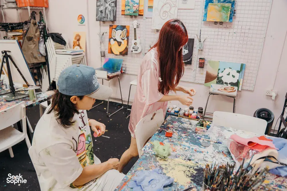 Crafting felt plushie keychains at Avant-Garde Art Space in Singapore at a shared studio table — workshops in Singapore