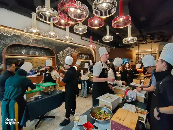 Chefs guide cooks plating dishes at Coriander Leaf’s Singapore kitchen during the Local Produce Cooking Challenge, workshops in Singapore
