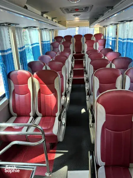 Empty passenger seats inside a Son Tung Express bus for Cat Ba to Halong transfer, ready for ferry ticket journey
