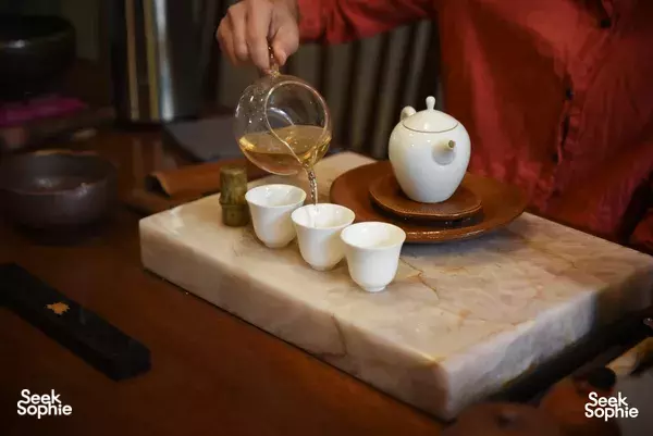 Vietnamese tea ceremony at Hien Minh Tea in Hanoi, with teapot and small cups on a stone tea table tea service