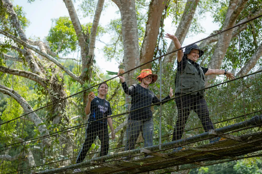 Crossing the bridge into Kiulu Village