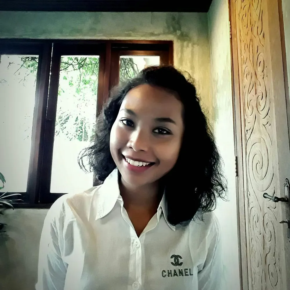 Putu when she was working as a hotel receptionist